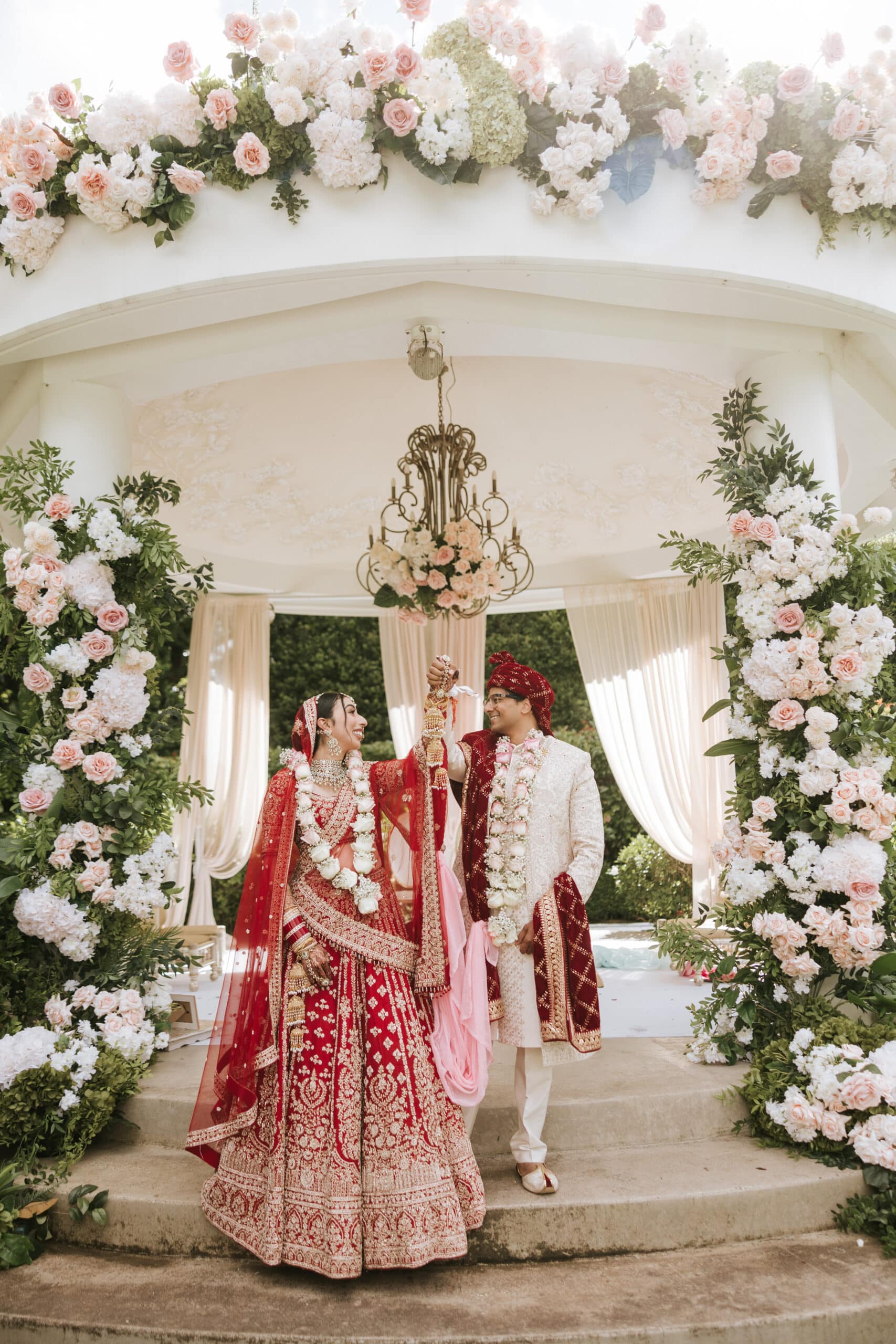 Annika and Abhishek under the mandap at their Hindu wedding ceremony at Miramare Gardens, Sydney